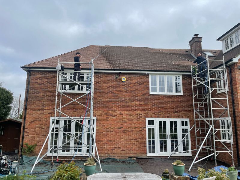 Roof cleaning carried out safely from scaffold towers by The Roof Moss Cleaners in Denmead